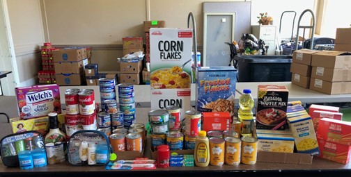 Canned, Nonperishable Goods And Food On A Table At The Salvation Army